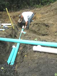 Drain pipes carrying water to the infiltration trench